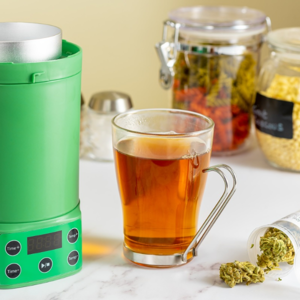 Nebula Decarboxylator & Infuser with cup of tea and CBD flower