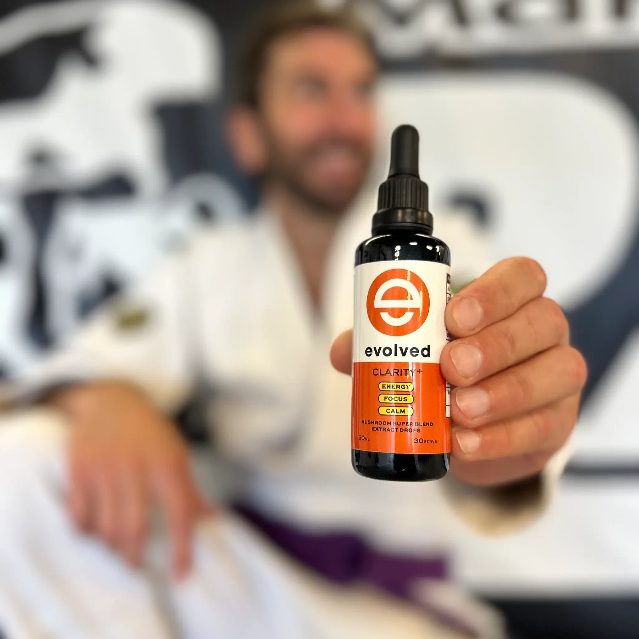 Man holding Evolved Daily Clarity+ with Focus Gummies | Bundle